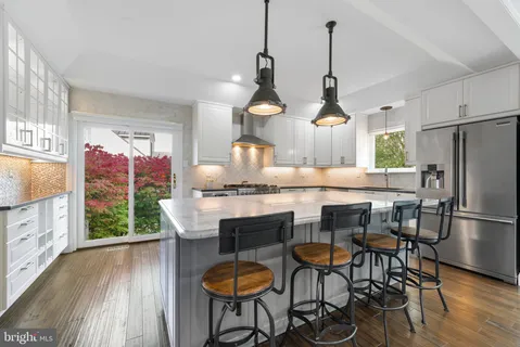 a kitchen with counter top space and stainless steel appliances