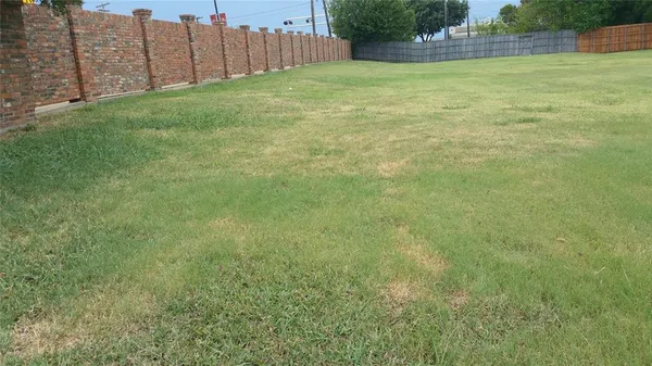 a view of yard with swimming pool and green space