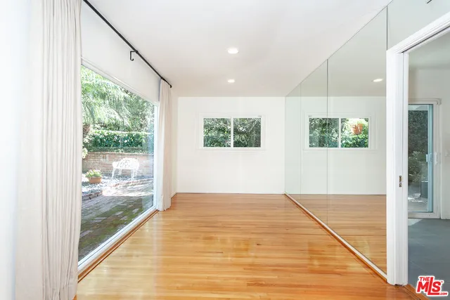 a view of an empty room and window