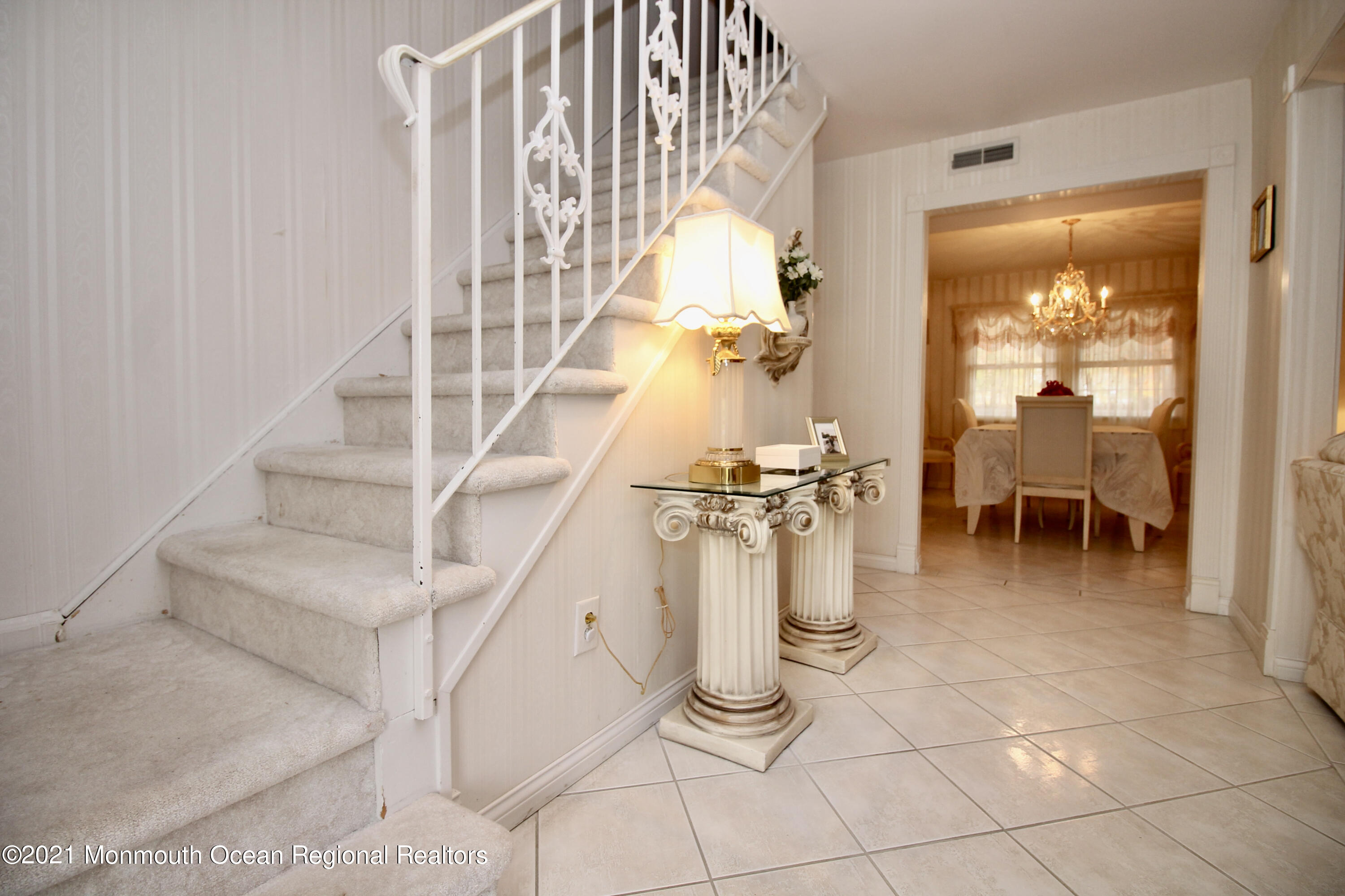 61 Crosswicks Road Freehold, NJ 07728 - Photo 9 of 43 a view of entryway and hall with dining room