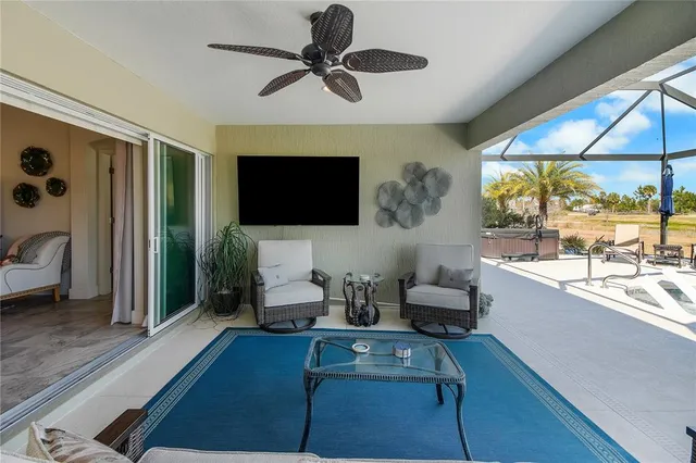 a kitchen with stainless steel appliances a table chairs refrigerator and chairs