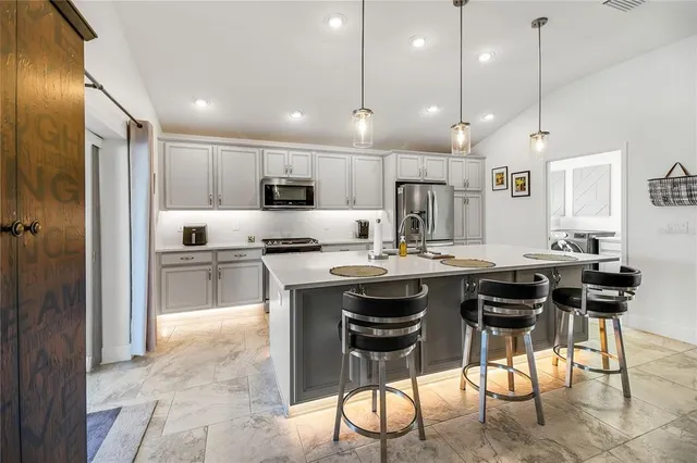 a kitchen with a sink and cabinets