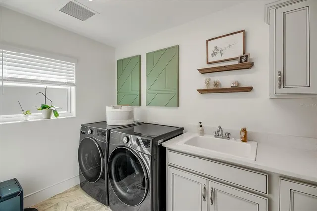 a bedroom with furniture and wooden floor