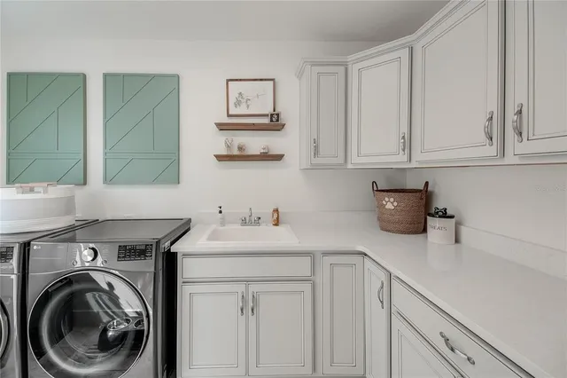 a bedroom with a bed a couch and dresser