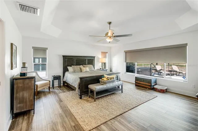 a bathroom with double vanity sink a mirror and a shower