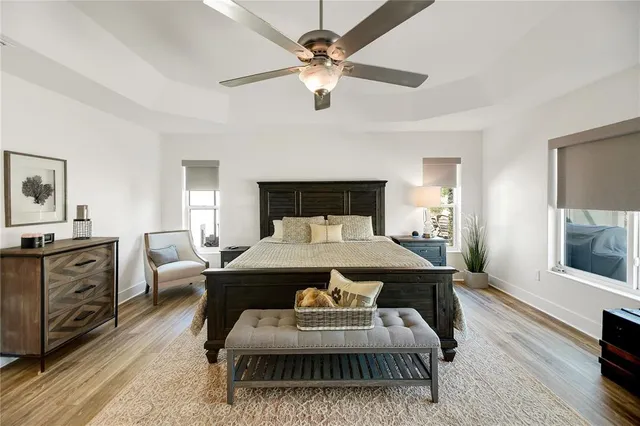 a bathroom with a double vanity sink mirror and bathtub