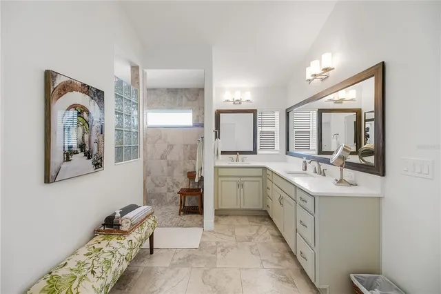 a living room with lots of furniture and kitchen view