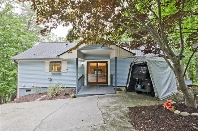 a view of a house with a yard and garage