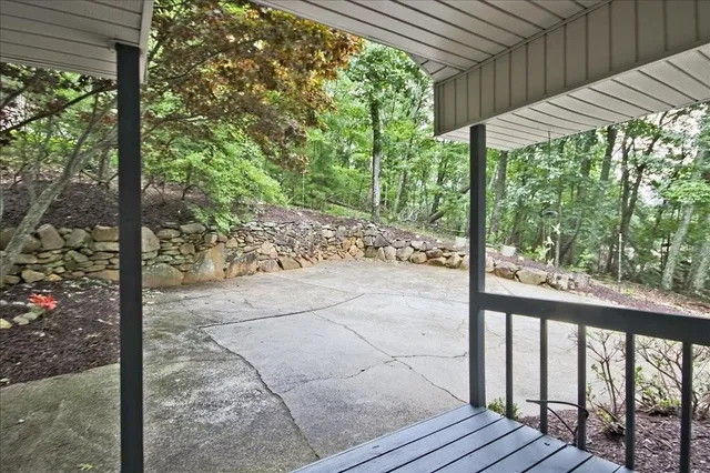 a view of a chairs and table in the backyard