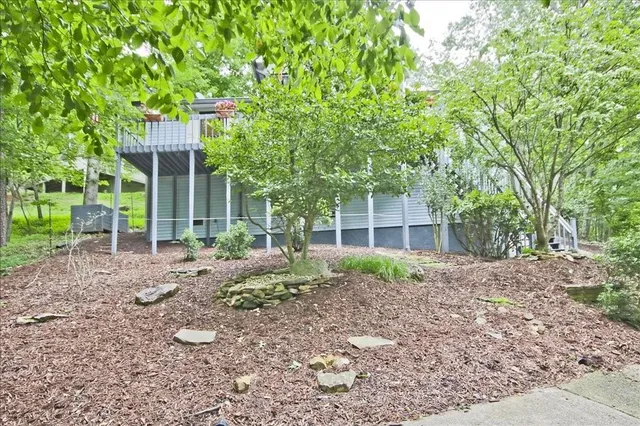 a house view with a backyard space