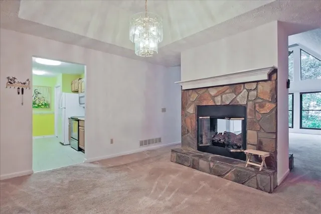 a bedroom with a bed and a fireplace
