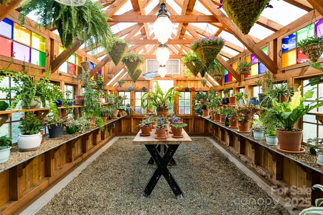 aerial view of a house with a yard and garden