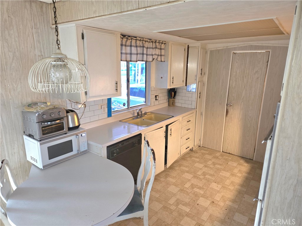 2230 Lake Park Drive, Unit 54 San Jacinto, CA 92583 - Photo 11 of 22 a kitchen with a stove a sink and a refrigerator