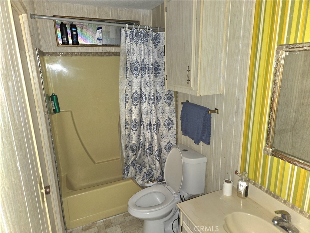 2230 Lake Park Drive, Unit 54 San Jacinto, CA 92583 - Photo 15 of 22 a bathroom with a toilet and a shower