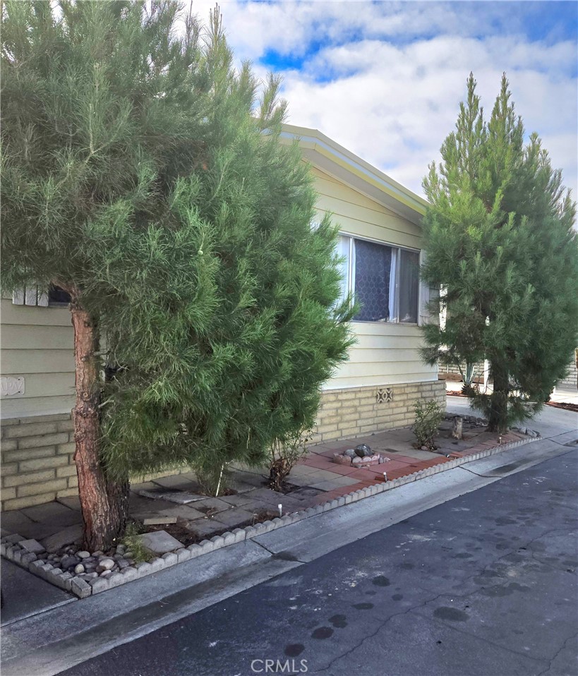 2230 Lake Park Drive, Unit 54 San Jacinto, CA 92583 - Photo 3 of 22 a view of a house with a yard