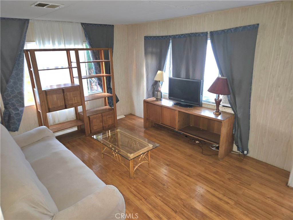 2230 Lake Park Drive, Unit 54 San Jacinto, CA 92583 - Photo 6 of 22 a living room with furniture and a fireplace