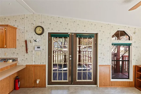 a kitchen with stainless steel appliances granite countertop a sink and a refrigerator
