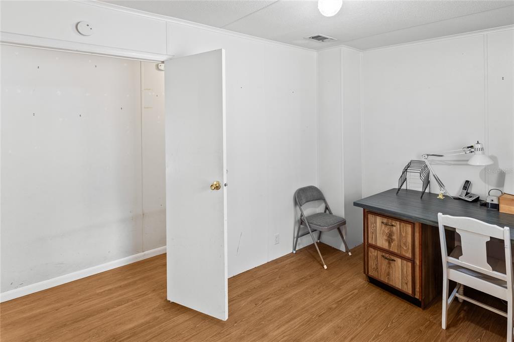 110 Hill Top Loop Hawthorne, FL 32640 - Photo 26 of 52 a view of a workspace with furniture and wooden floor