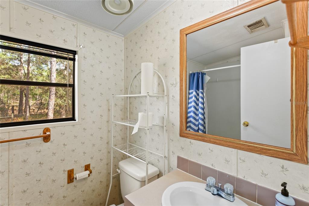 110 Hill Top Loop Hawthorne, FL 32640 - Photo 34 of 52 a bathroom with a bathtub and a shower