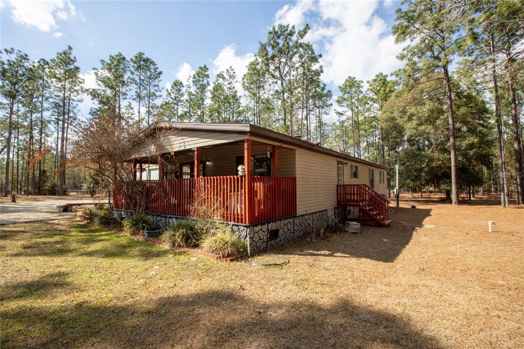 110 Hill Top Loop Hawthorne, FL 32640 - Photo 47 of 52 a view of a house with a yard covered in snow