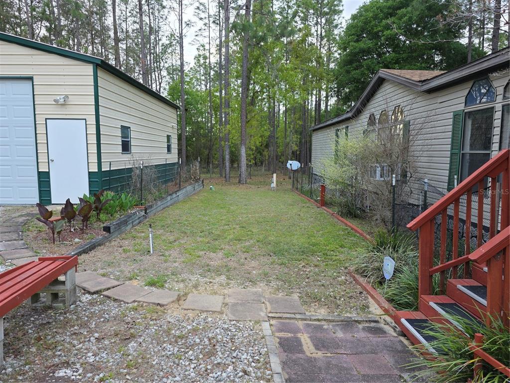 110 Hill Top Loop Hawthorne, FL 32640 - Photo 6 of 52 a backyard of a house with seating space