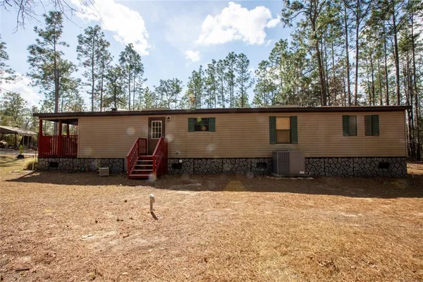 a view of a livingroom with furniture and a fireplace