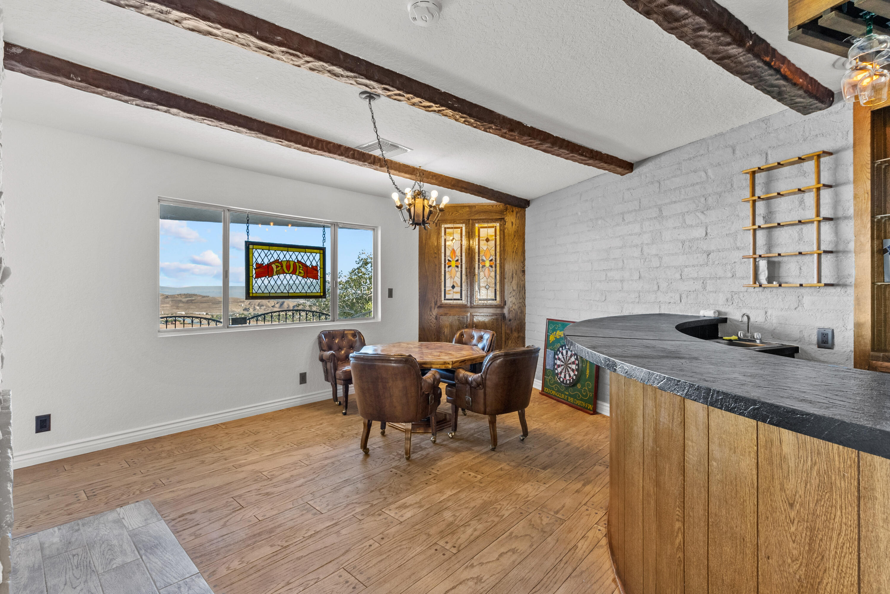 645 Lakeview Drive Palmdale, CA 93551 - Photo 22 of 78 a view of a dining room with furniture window and wooden floor
