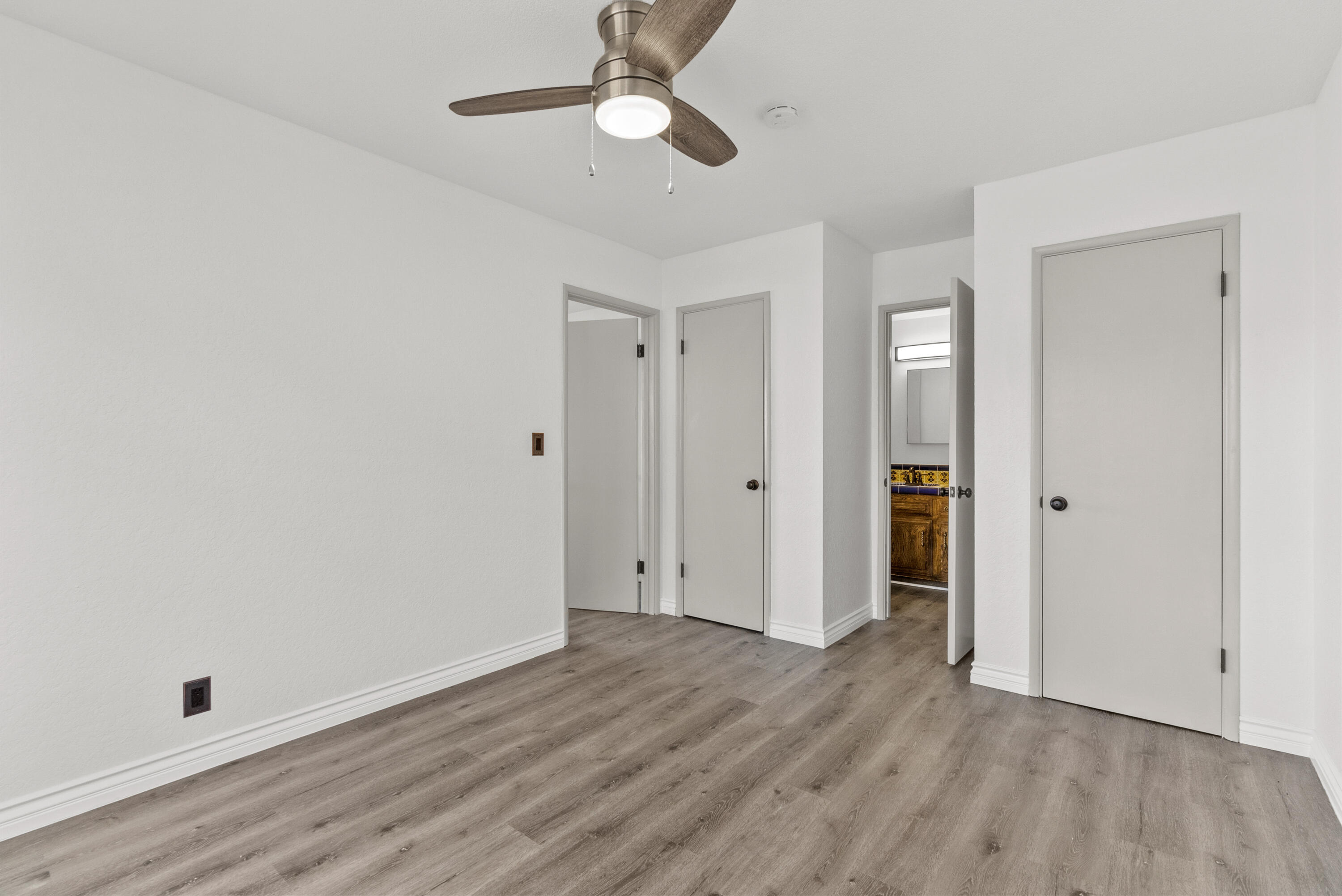 645 Lakeview Drive Palmdale, CA 93551 - Photo 32 of 78 wooden floor in an empty room with a window