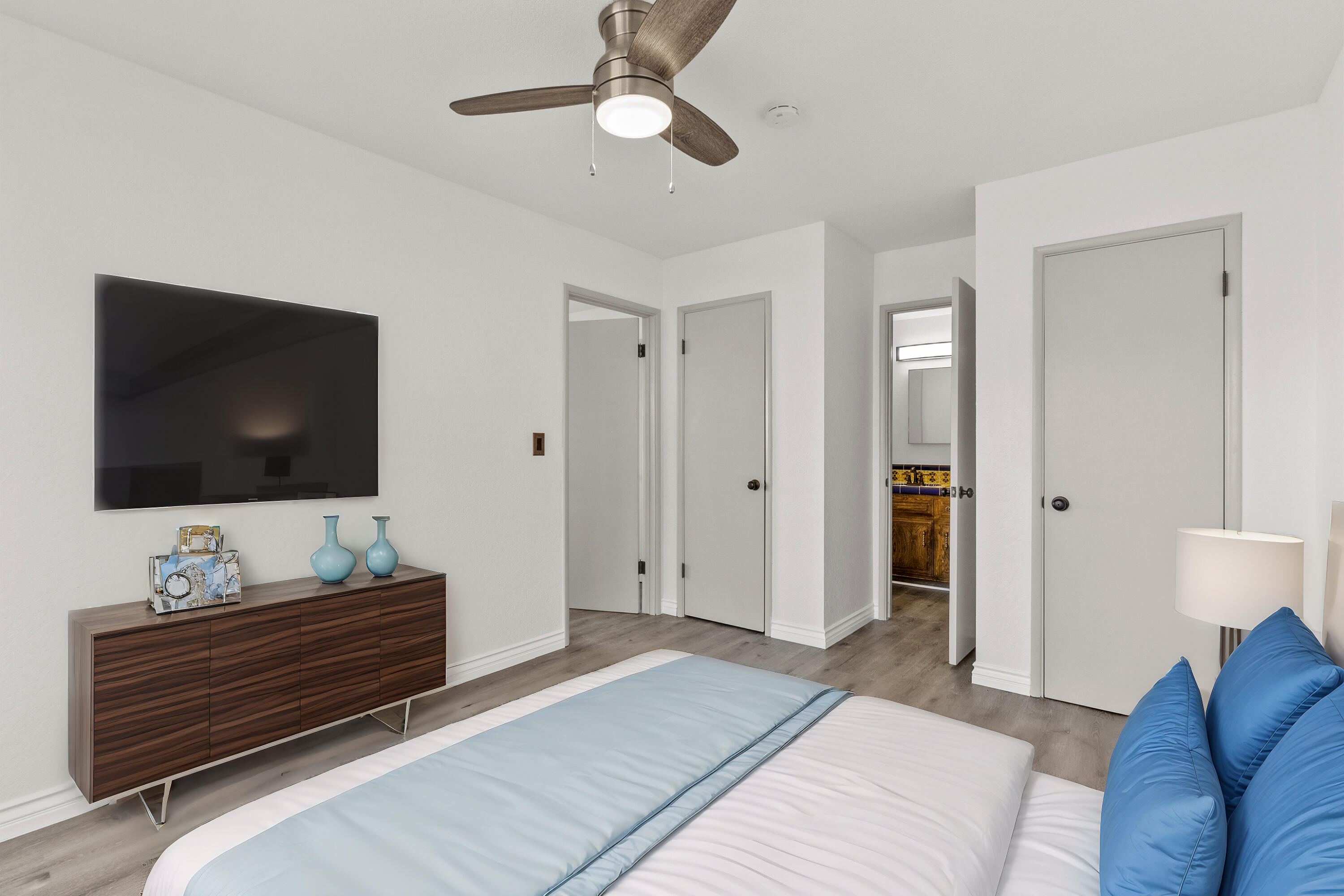 645 Lakeview Drive Palmdale, CA 93551 - Photo 33 of 78 a bedroom with a bed and a flat screen tv