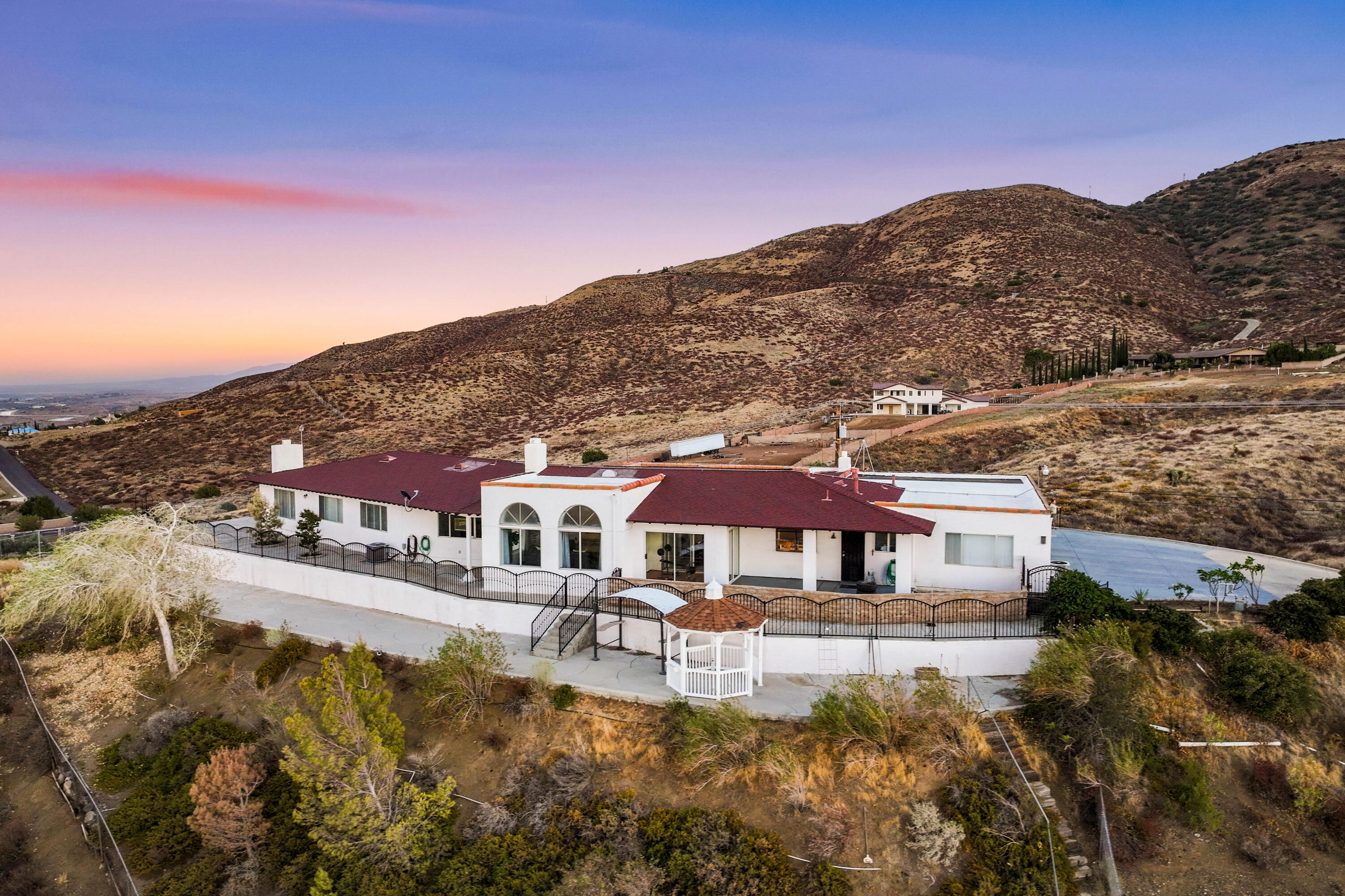 645 Lakeview Drive Palmdale, CA 93551 - Photo 4 of 78 a front view of a house with a yard mountain view