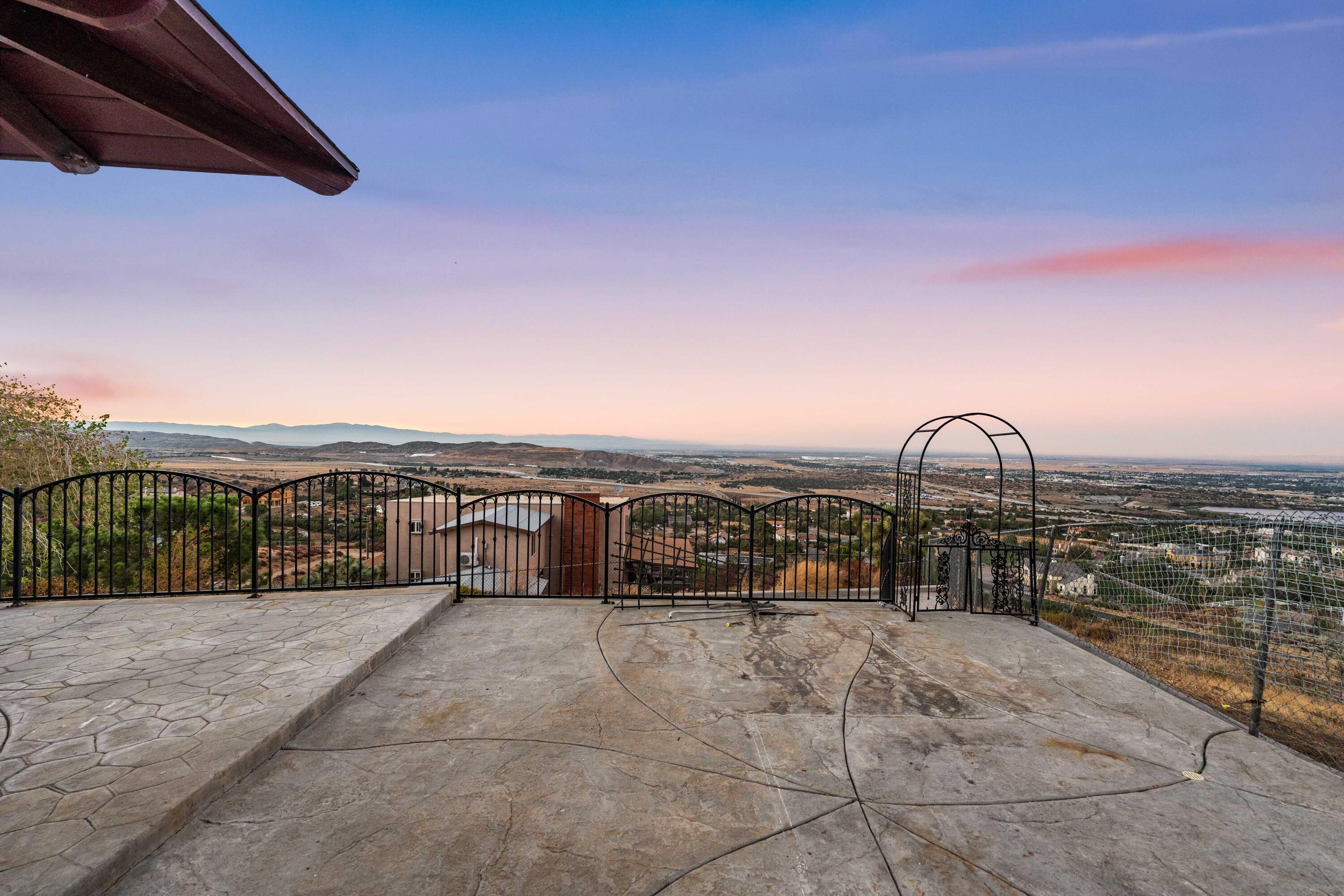 645 Lakeview Drive Palmdale, CA 93551 - Photo 67 of 78 a view of a terrace with a bench