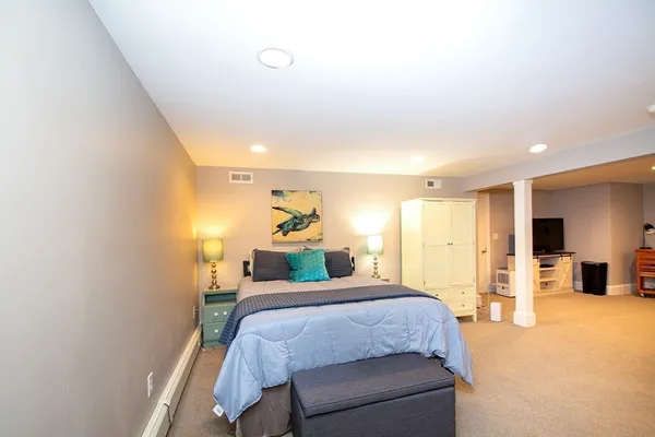 a bedroom with a bed and a table