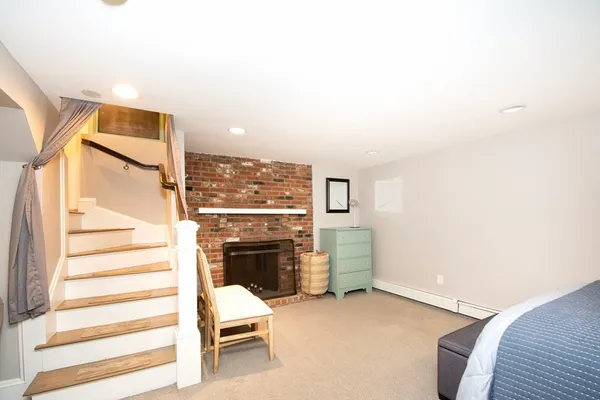 a view of a livingroom with furniture and staircase