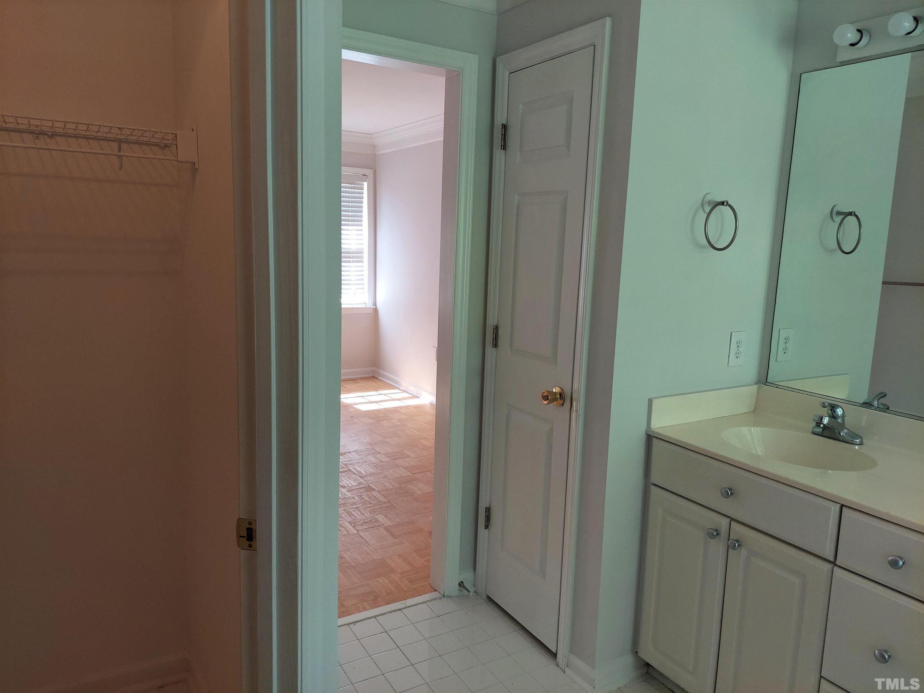 224 Crossfire Road Holly Springs, NC 27540 - Photo 24 of 43 a bathroom with a granite countertop sink and a mirror