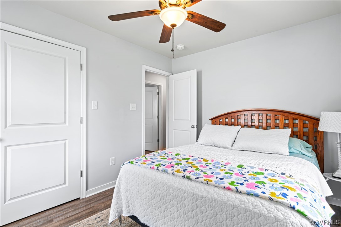 25500 Front Road Petersburg, VA 23803 - Photo 11 of 19 a bedroom with a large bed and a chandelier