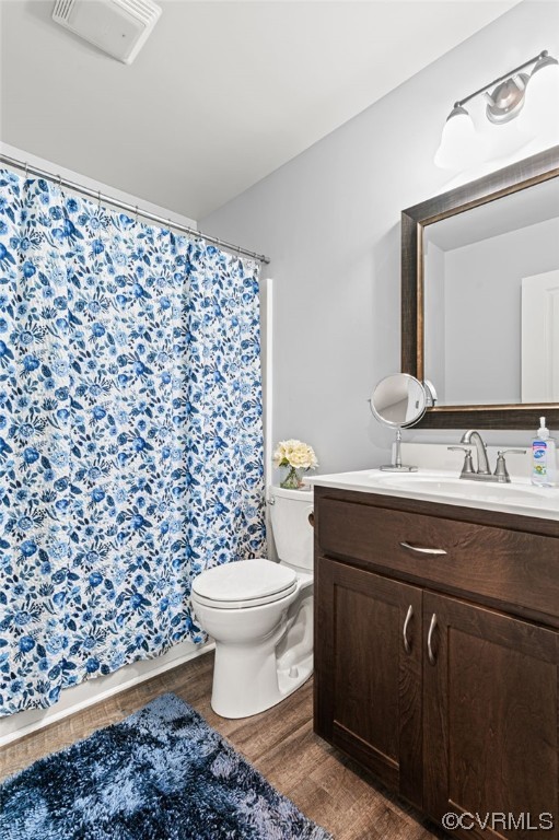 25500 Front Road Petersburg, VA 23803 - Photo 13 of 19 a bathroom with a granite countertop toilet a sink and a mirror