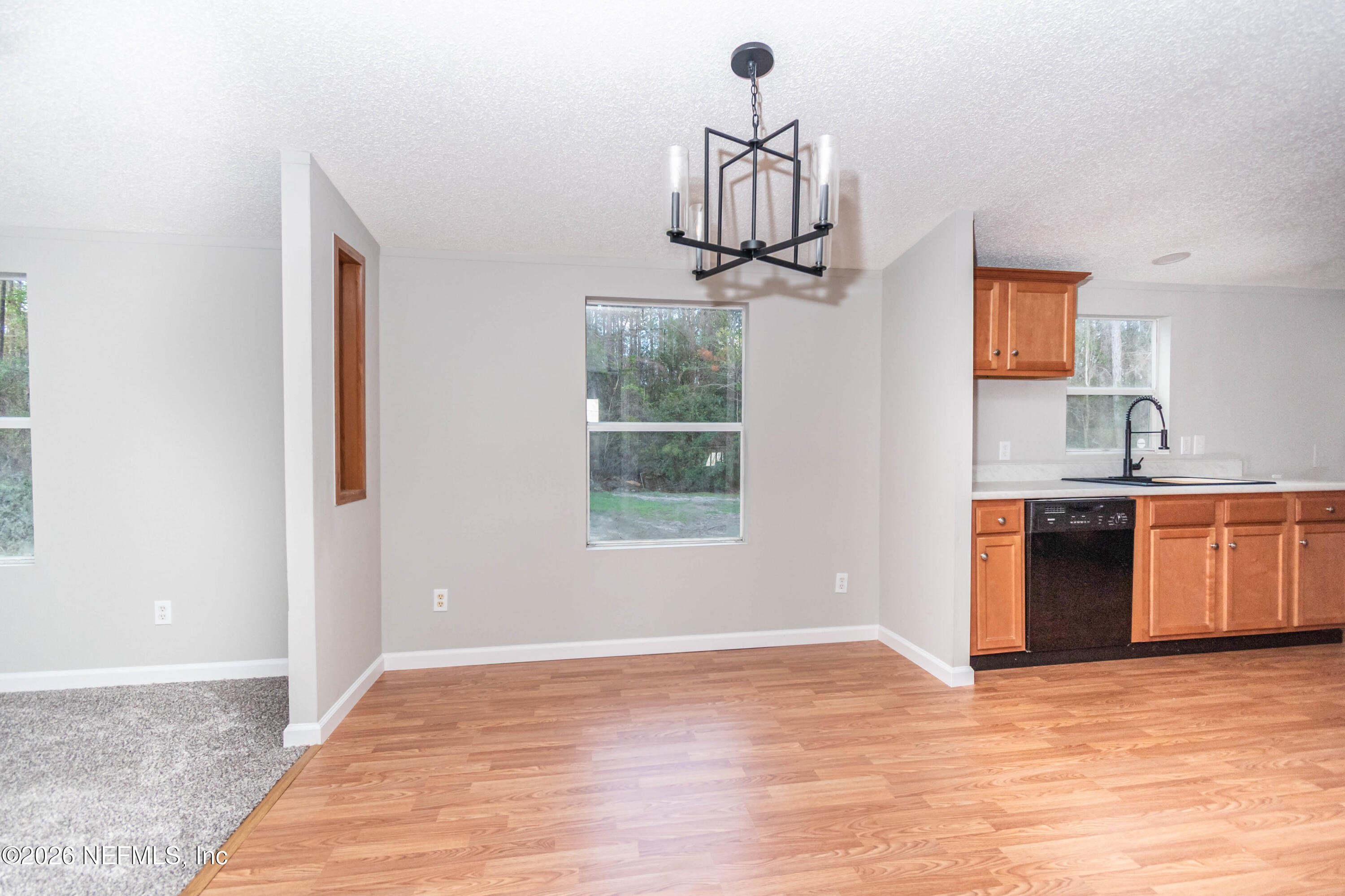 11017 County Road 229 Sanderson, FL 32087 - Photo 12 of 33 a view of a room with a kitchen and a window