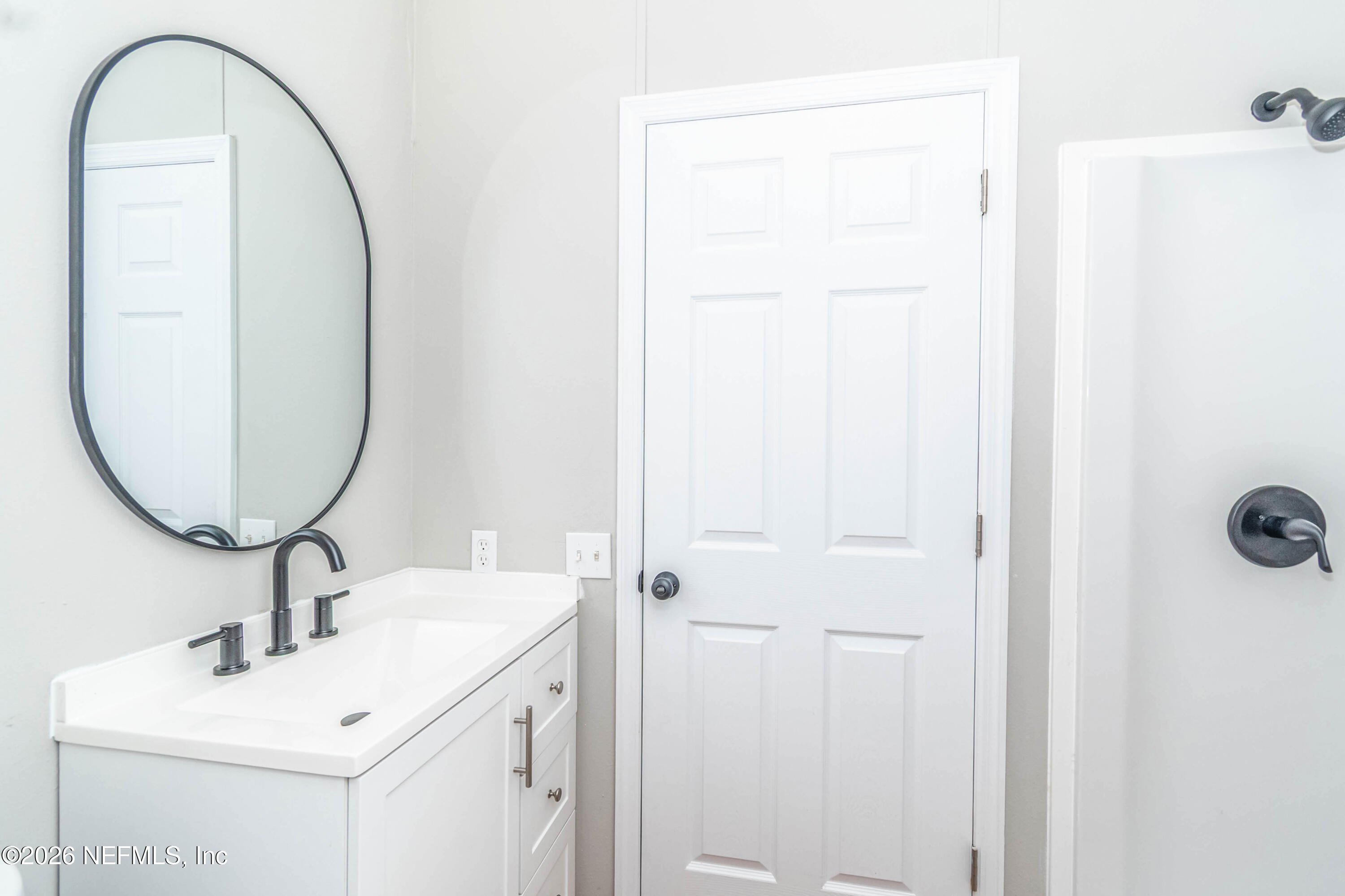 11017 County Road 229 Sanderson, FL 32087 - Photo 26 of 33 a bathroom with a sink and a mirror