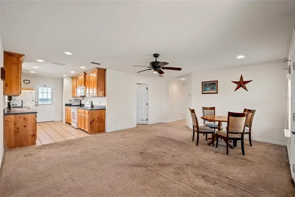 a kitchen with stainless steel appliances a sink stove and cabinets