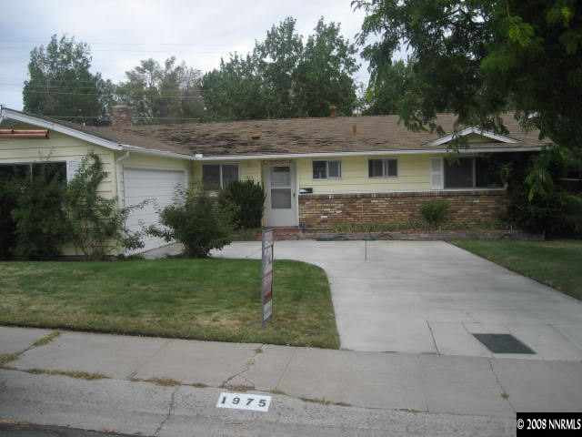 1975 Carlin Street Reno, NV 89503 - Photo 1 of 9 a front view of a house with a garden