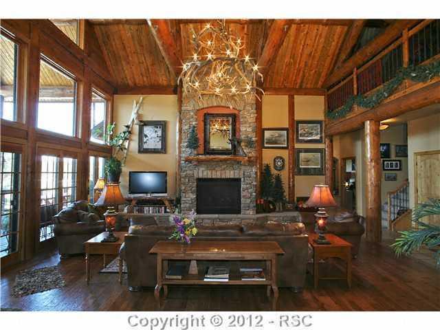 14365 Silverton Road Colorado Springs, CO 80921 - Photo 10 of 25 Huge Great Room with Stone Fireplace