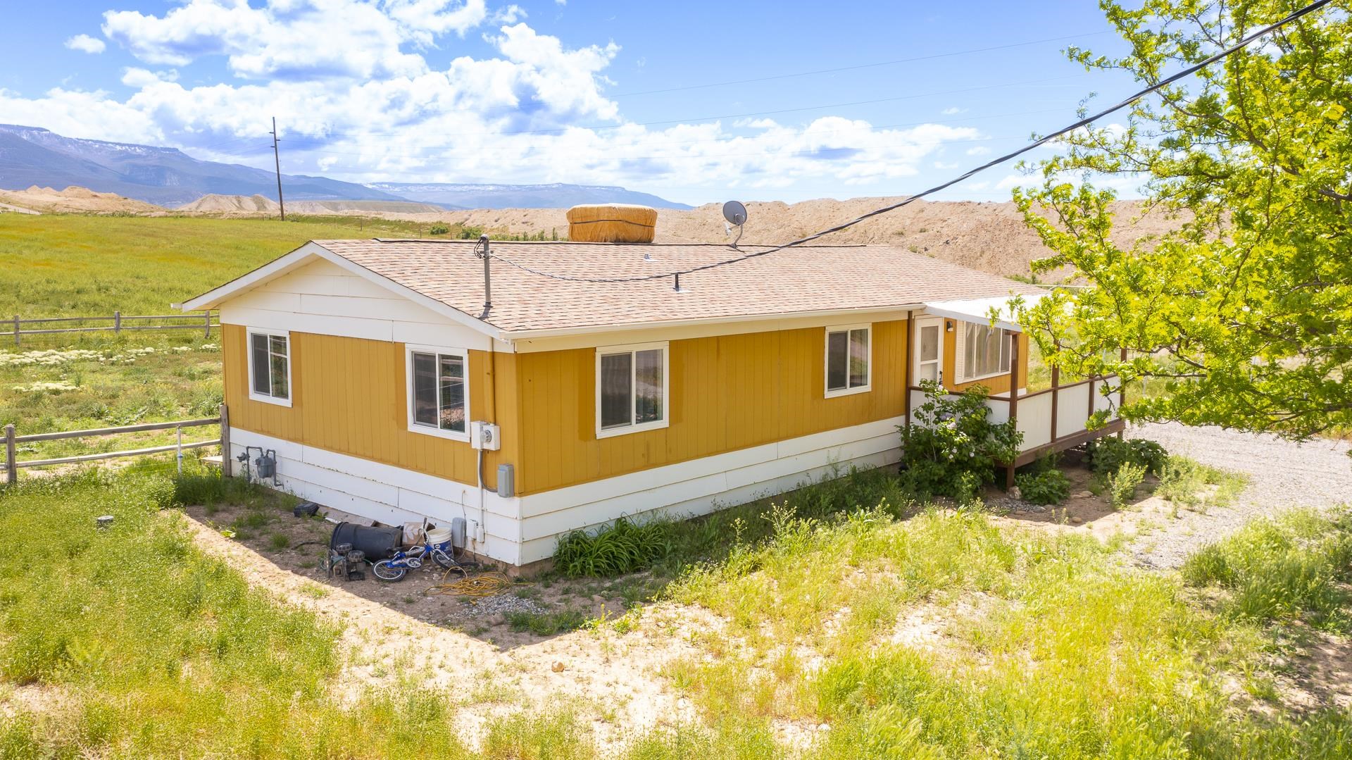 412 35 Road Palisade, CO 81526 - Photo 11 of 39 a front view of a house with a yard