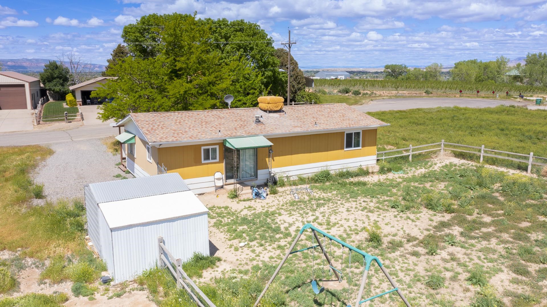 412 35 Road Palisade, CO 81526 - Photo 13 of 39 an aerial view of residential houses with outdoor space and trees