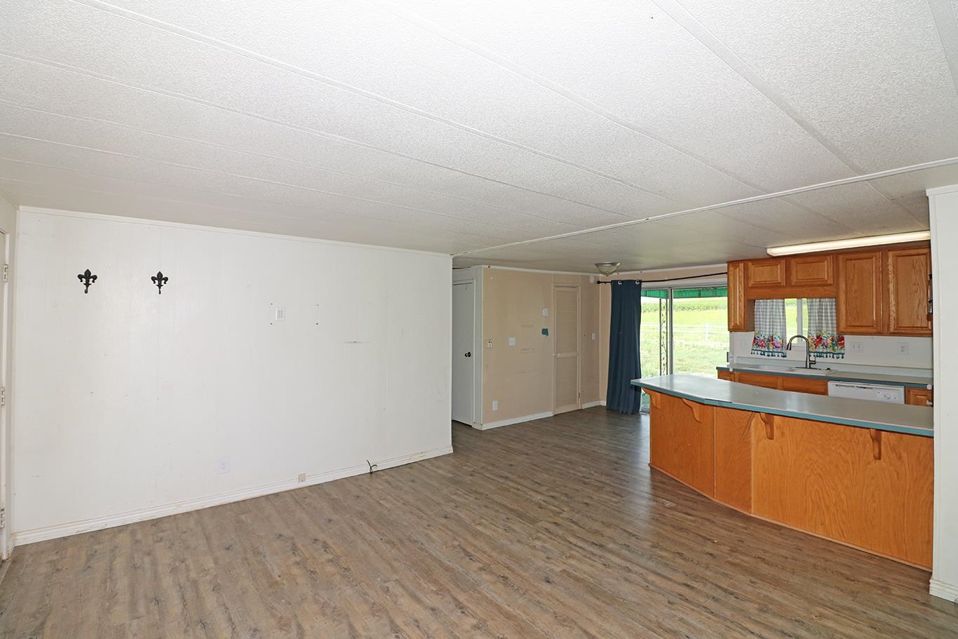 412 35 Road Palisade, CO 81526 - Photo 15 of 39 a view of a kitchen with wooden floor and a sink