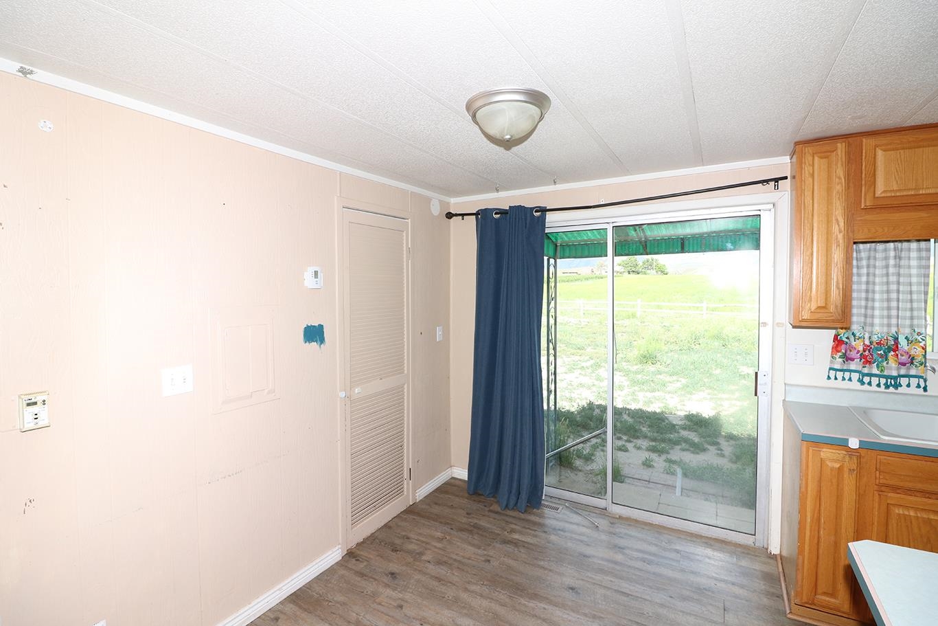 412 35 Road Palisade, CO 81526 - Photo 20 of 39 a view of an empty room with wooden floor and a window