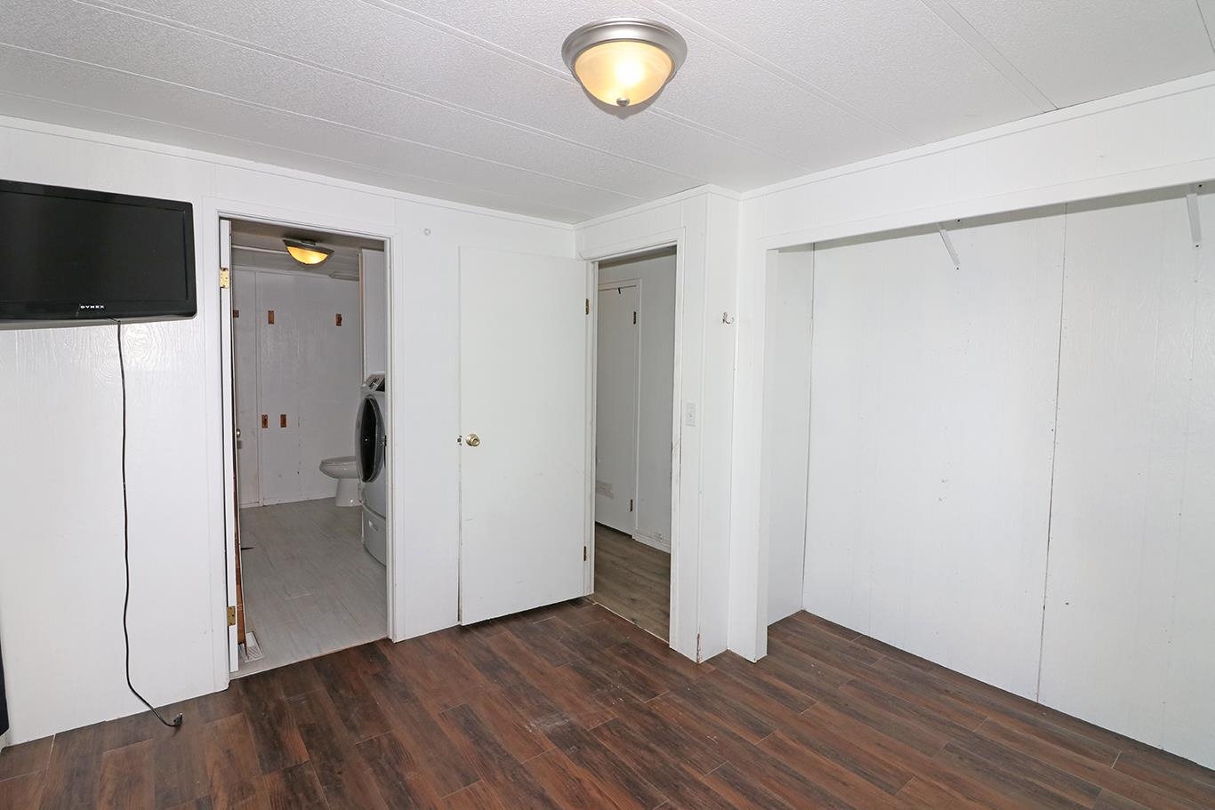 412 35 Road Palisade, CO 81526 - Photo 22 of 39 a view of an empty room with wooden floor and closet