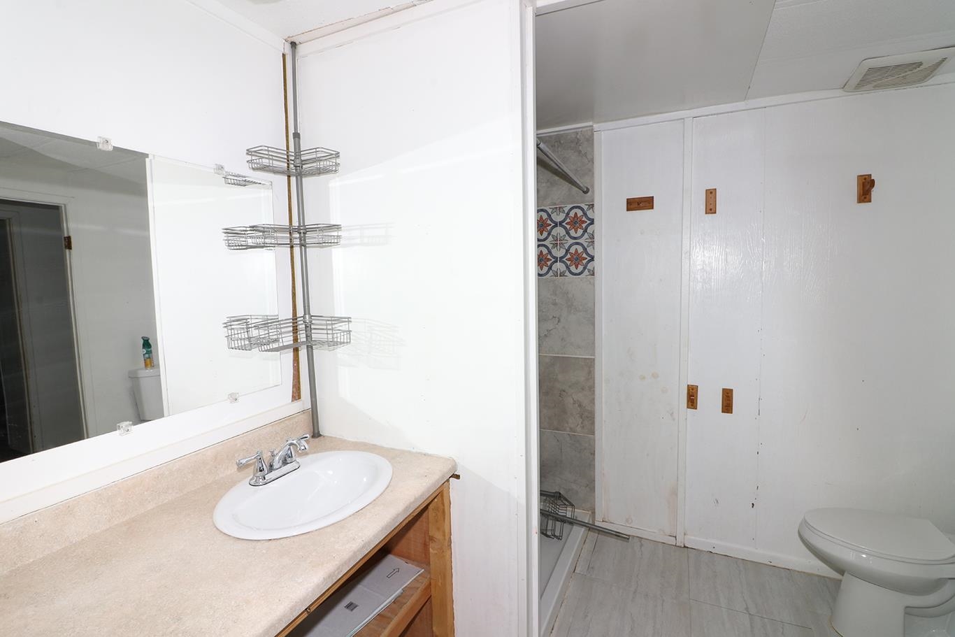 412 35 Road Palisade, CO 81526 - Photo 24 of 39 a bathroom with a sink vanity mirror and toilet