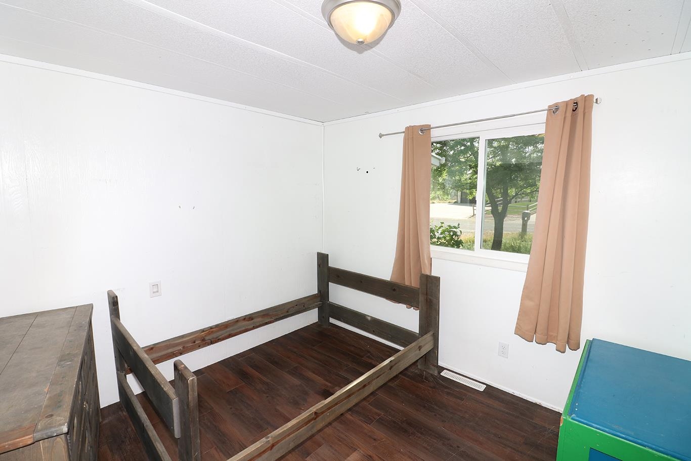 412 35 Road Palisade, CO 81526 - Photo 27 of 39 a view of wooden floor and chair in a room