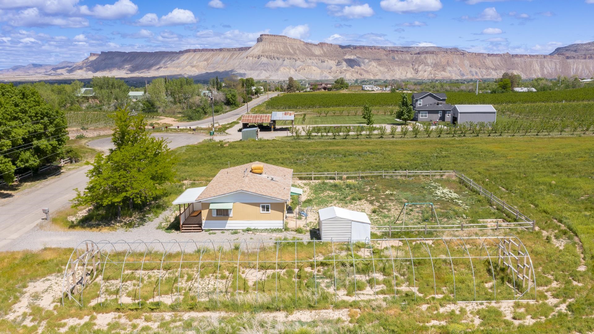 412 35 Road Palisade, CO 81526 - Photo 38 of 39 a aerial view of a house with a garden
