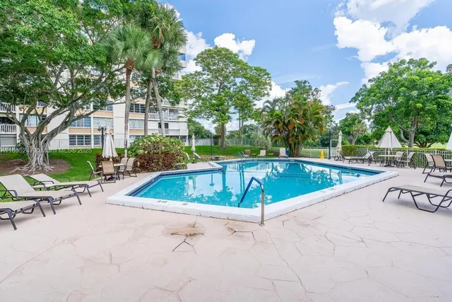 a view of swimming pool with chairs